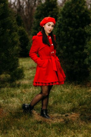 Fashion portrait of woman in red coat and beret against evergreen trees.
Janesville, WI
Brodhead, WI