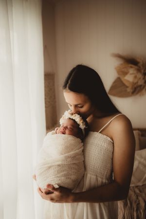 golden newborn session warm tones