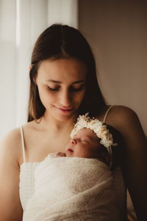 golden newborn session warm tones
