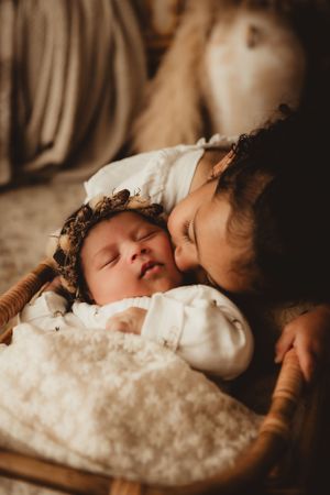 golden newborn session warm tones