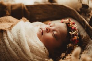 golden newborn session warm tones