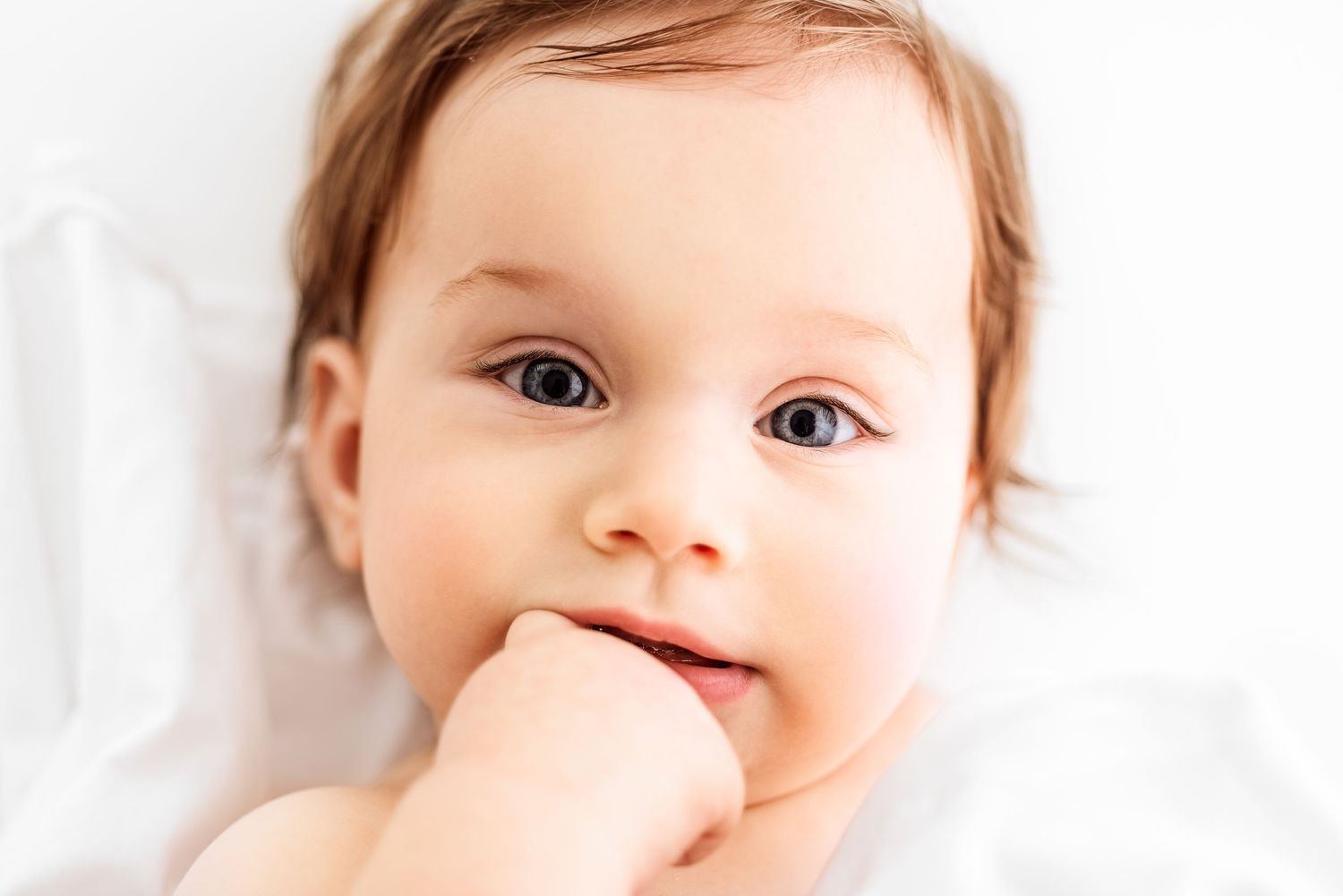 milestone baby photos in all white studio
