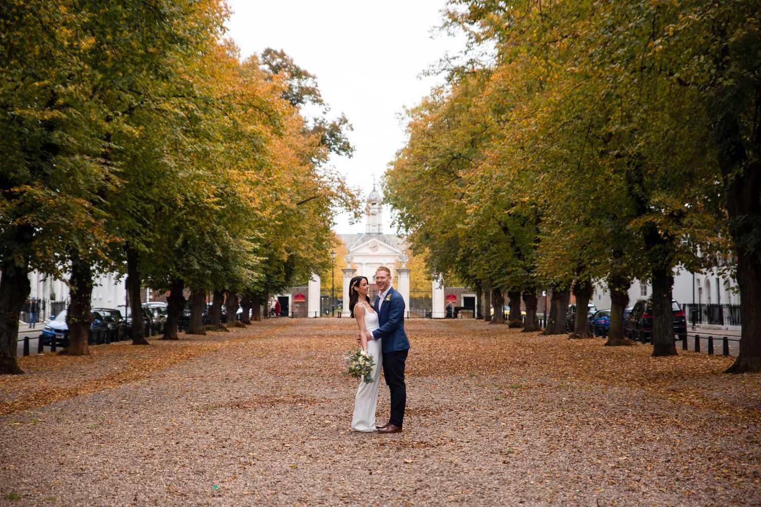 bride and groom in chelsea london surrounded by trees