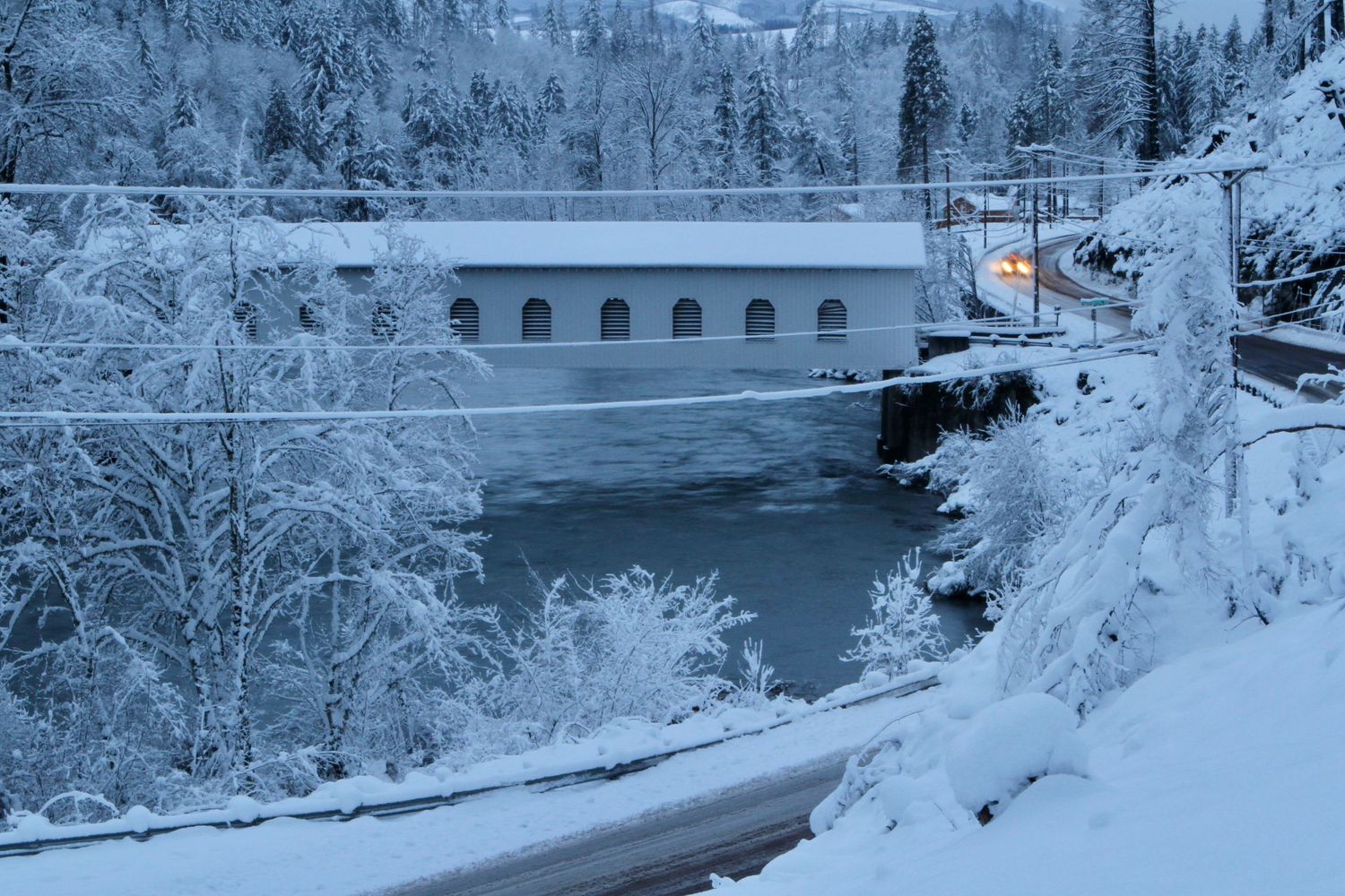Historic Goodpasture covered bridge in snow, Oregon