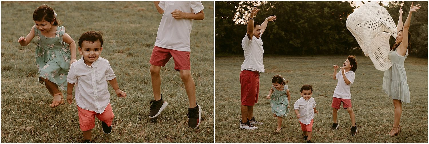 Children playing and jumping joyfully in a grassy field on a warm summer evening.