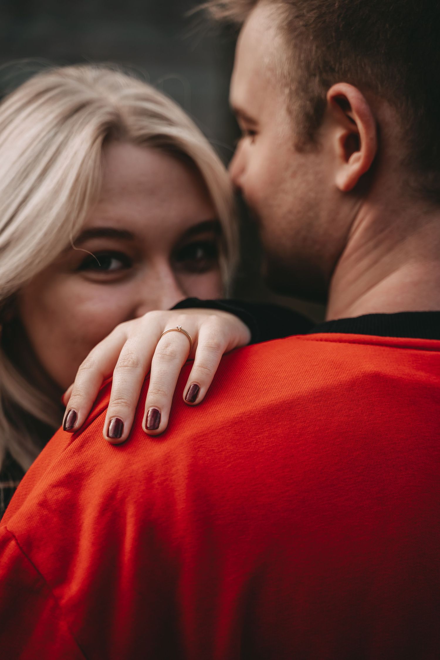 Close-up sequence showing intimate moments with someone wearing a bright red shirt.