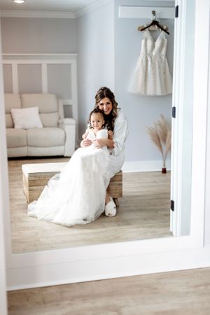 A series of elegant white wedding dress photos displayed in minimalist white frames against a neutral wall.Middle TN wedding photographer