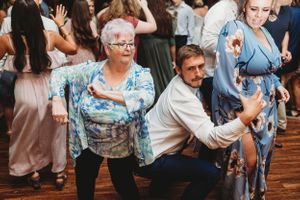 Wedding guests enjoying themselves on a dance floor at an indoor reception venue. Middle TN wedding photographer
