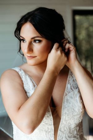 Close-up shots of bridal details featuring lace wedding dress and jewelry. Middle TN wedding photographer