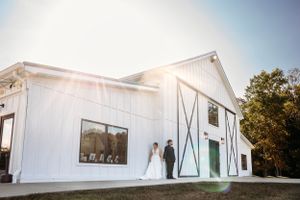 White barn wedding venue exterior with elegant architectural details. Middle TN wedding photographer