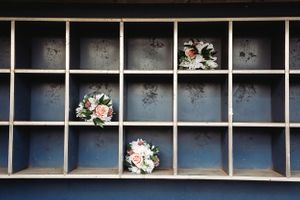 Black display grid with small white floral arrangements placed in individual compartments. Middle TN wedding photographer
