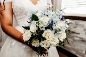 White roses and blue floral bouquets arranged for an elegant wedding ceremony.Middle TN wedding photographer