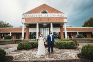 Exterior view of Fitchville City Hall brick building with wedding couple. Middle TN wedding photographer
