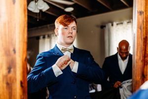 Groomsmen in formal attire preparing for the wedding ceremony. Middle TN wedding photographer