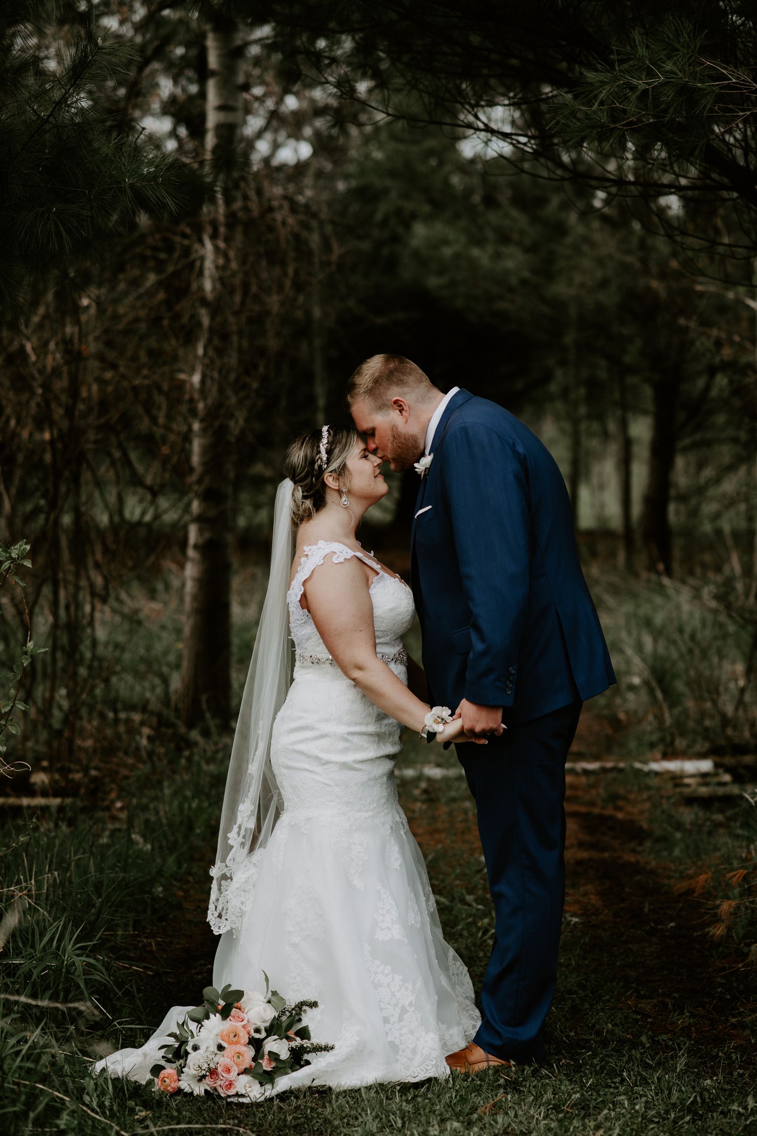 groom kissing his brides nose