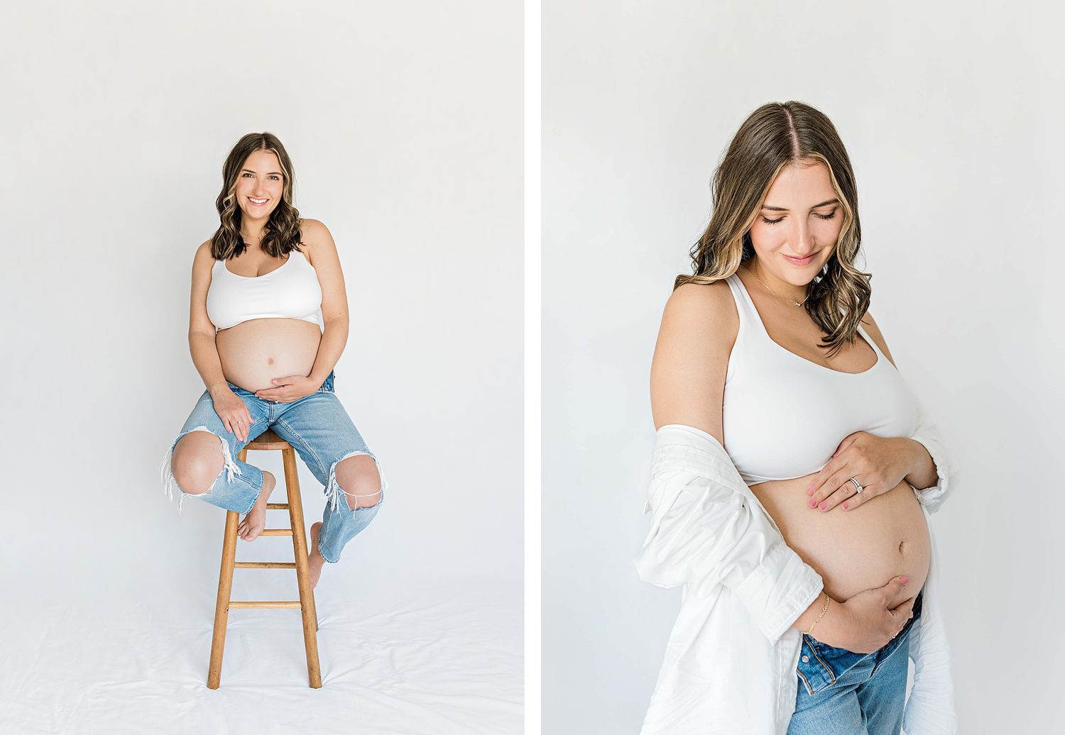 Maternity photoshoot featuring casual style with white top, ripped jeans and wooden stool against white backdrop.