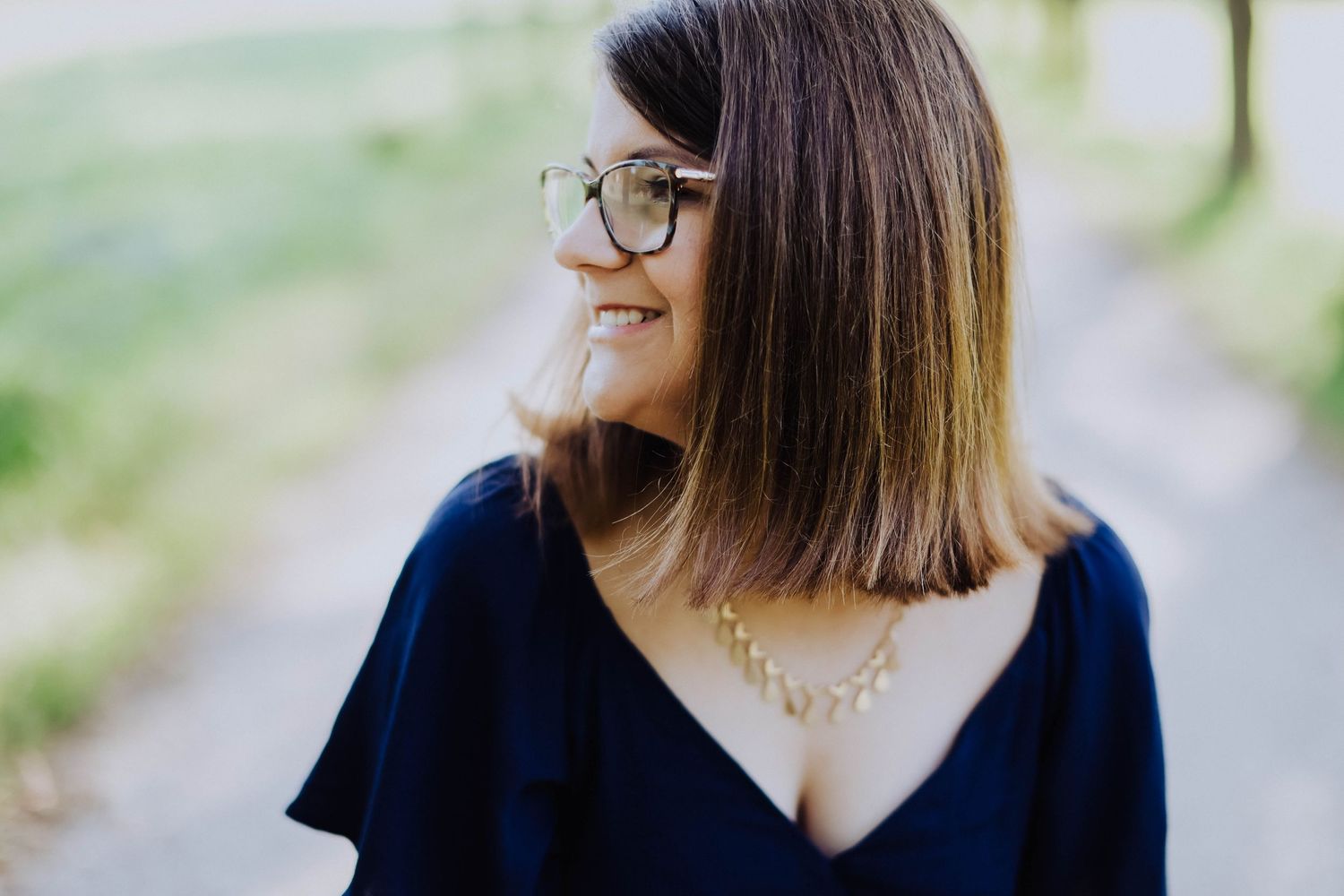 Person in navy blue top with casual style.