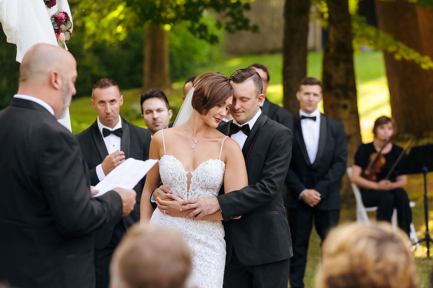 The bride and groom enjoy a close intimate moment during the ceremony.