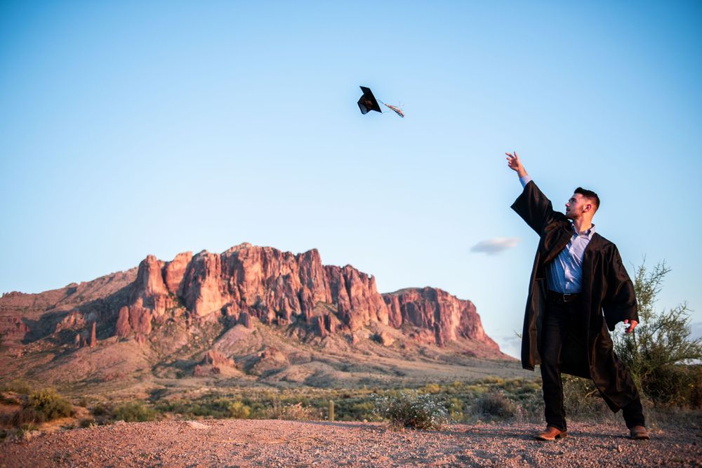 Graduation photos with cap tossing silhouettes against red desert rock formations.