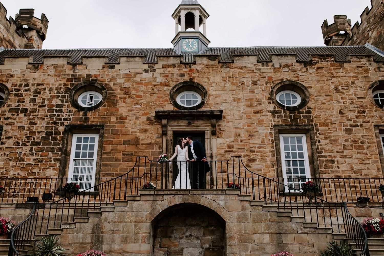 Lumley Castle wedding with couple at front top of steps