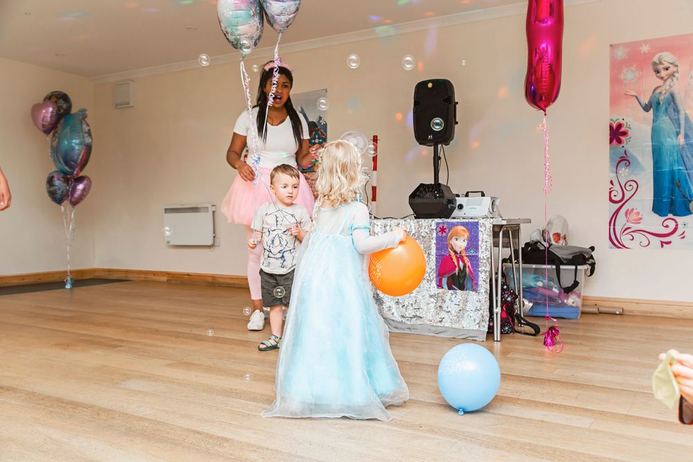 Birthday girl dancing with guests