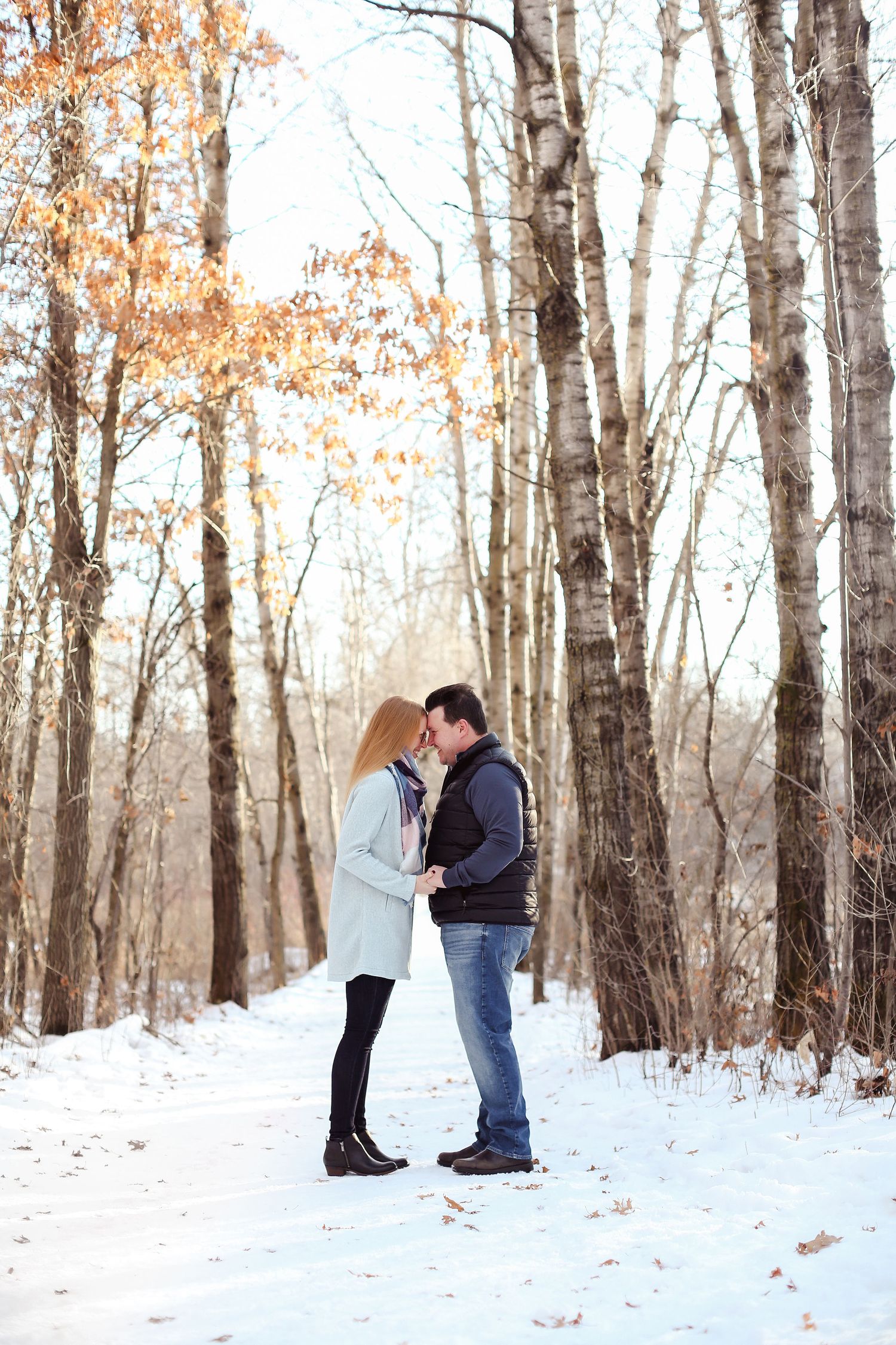 Cozy Minnesota winter couples engagement session with snow and birch trees by Laura Leigh Images
