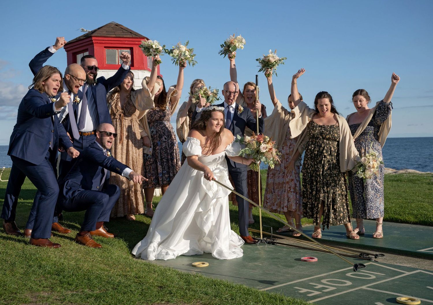 wedding party playing shuffle board captured by a wedding photographer in Cape Cod, MA