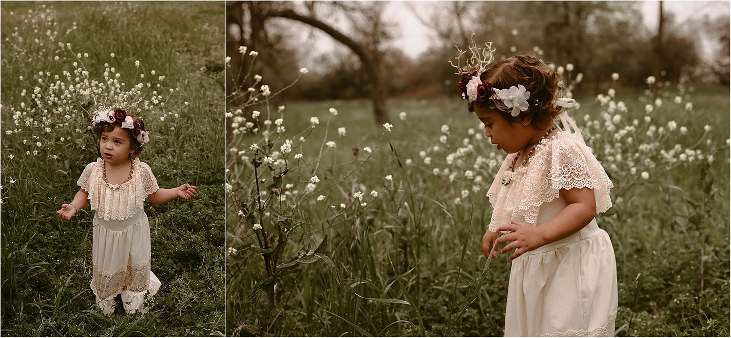 A child in white dress plays among wildflowers in a whimsical outdoor setting.