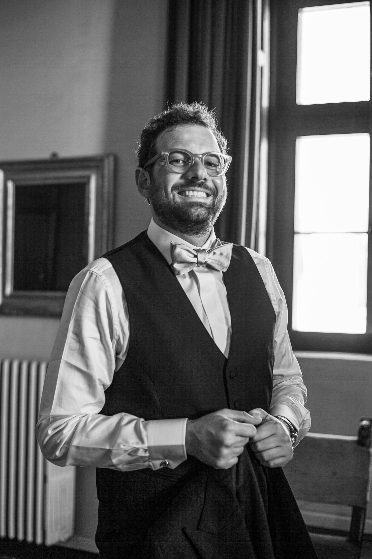 A joyful moment captured in formal wedding attire.