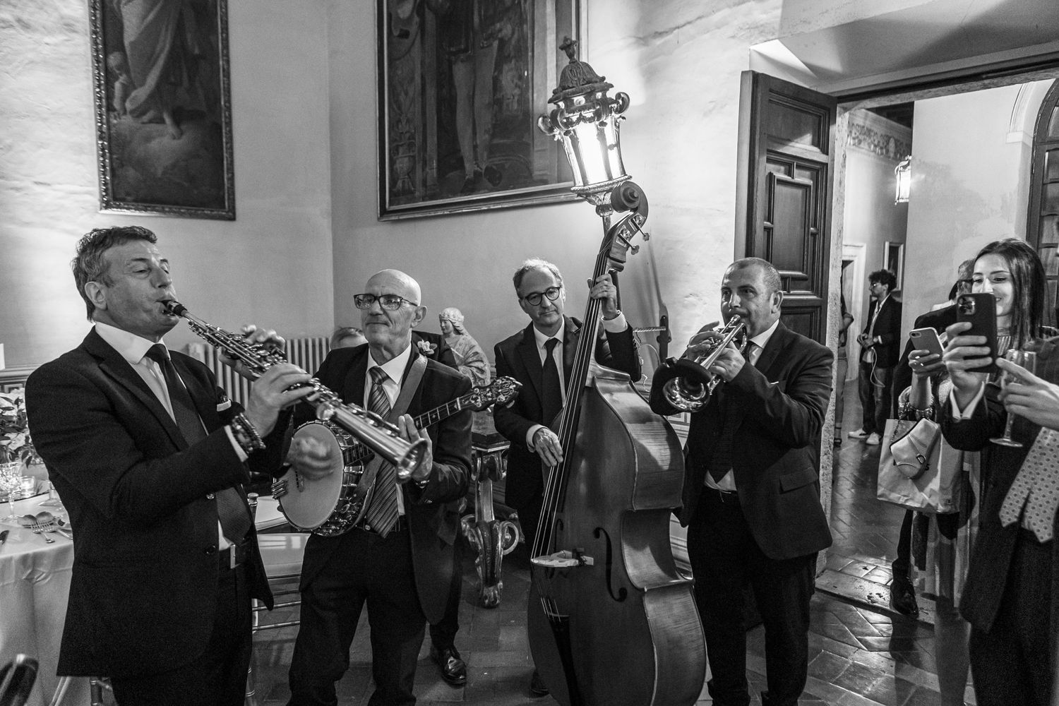 Classic black and white photo of a jazz band performing during a wedding reception.