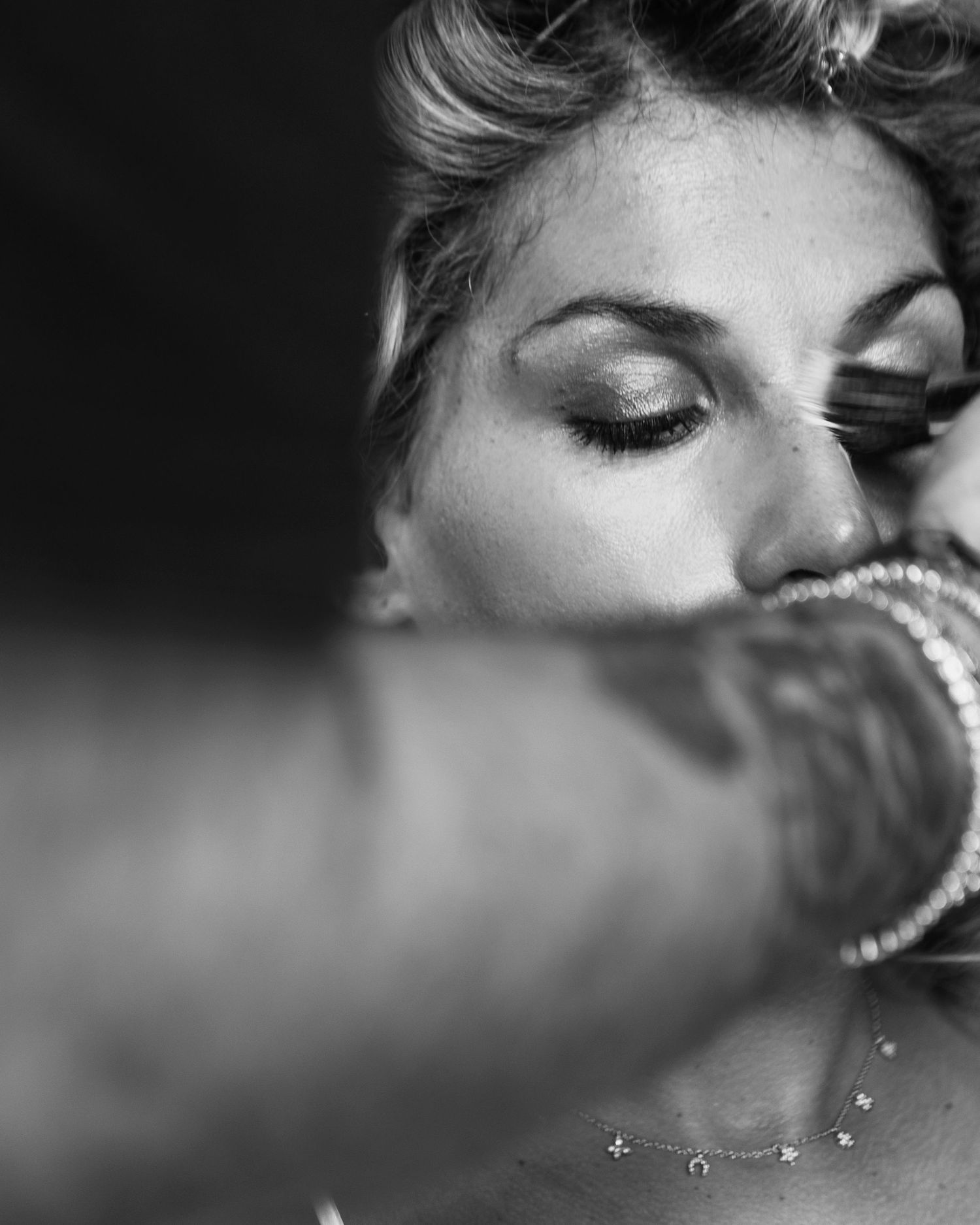 Artistic black and white close-up photograph with soft focus and dramatic lighting.