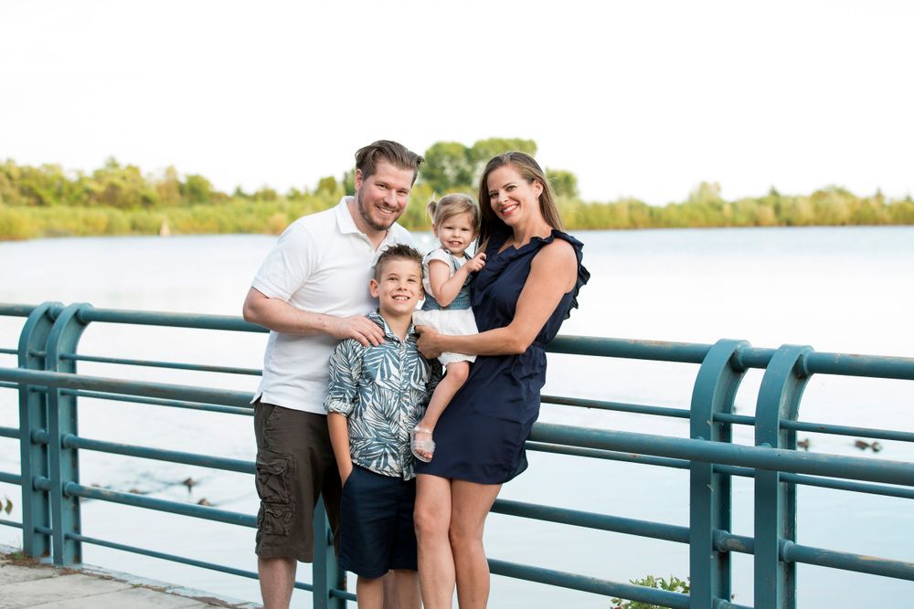 Family of 4 together by the Etobicoke marina having fun.
