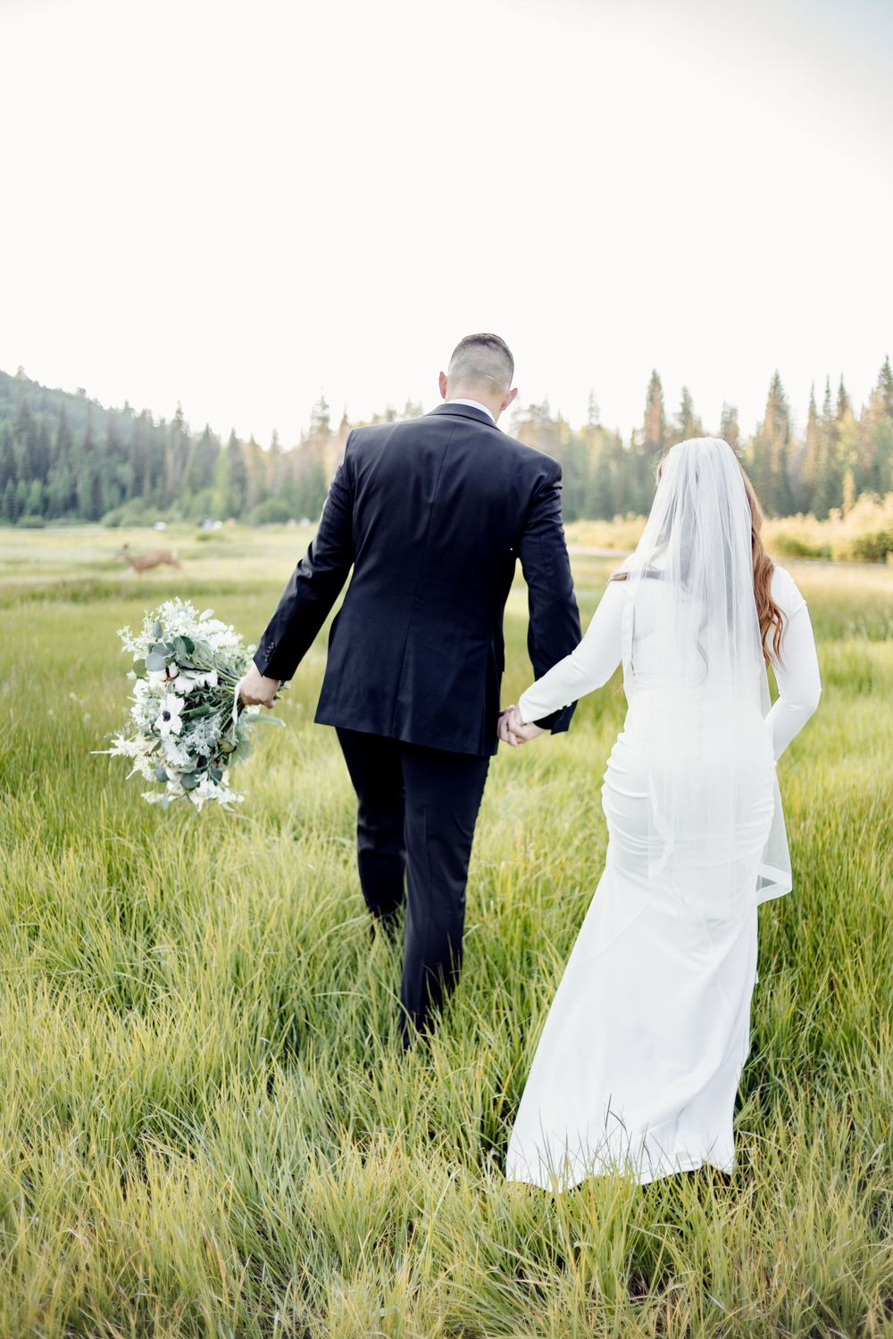married couple walking in missouri grasslands