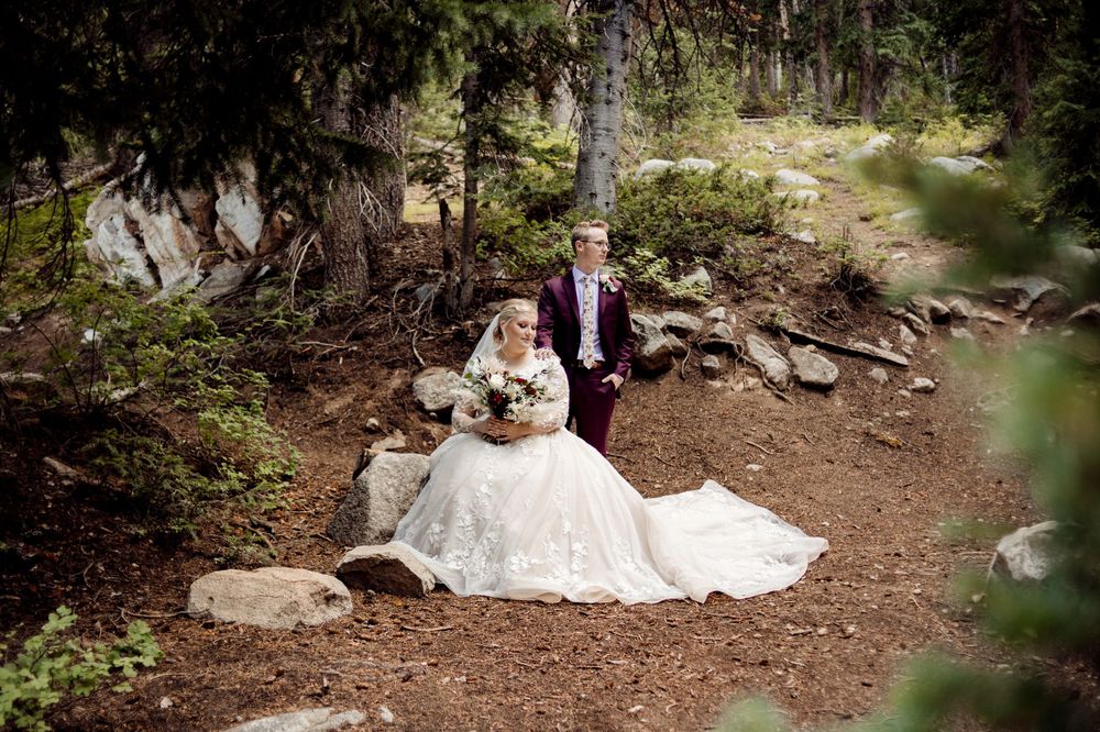timeless bride and groom sitting for bridal portraits in missouri forest