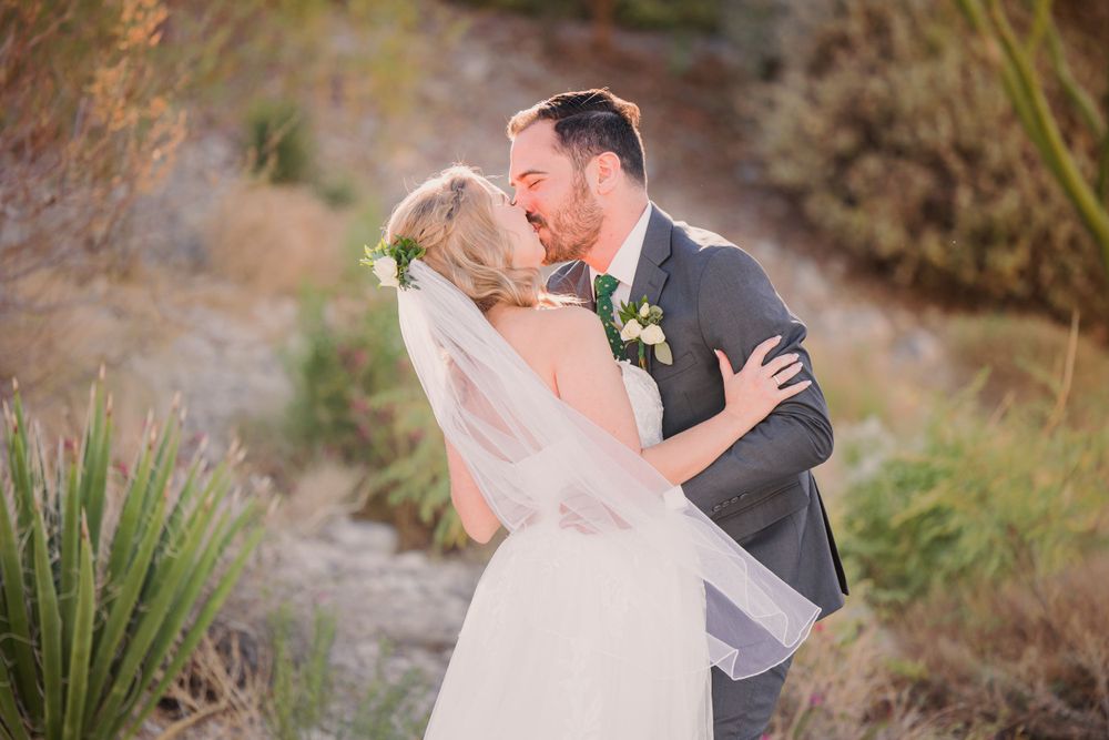 Couple sharing an intimate dance moment during their desert wedding photoshoot.