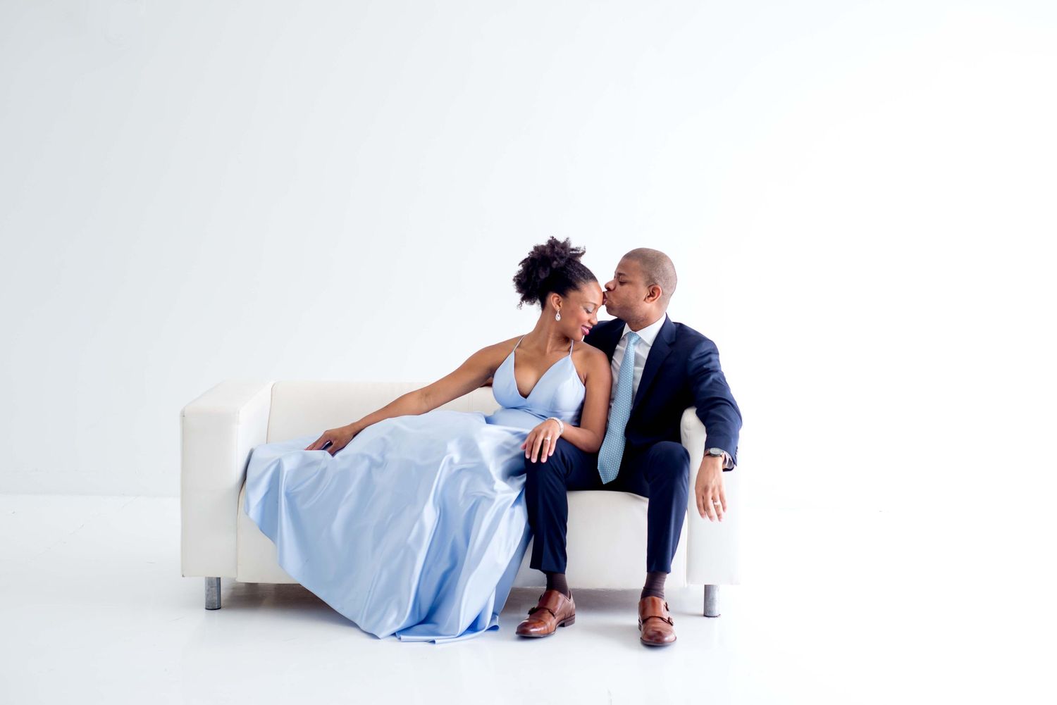 husband and wife portraits in white studio