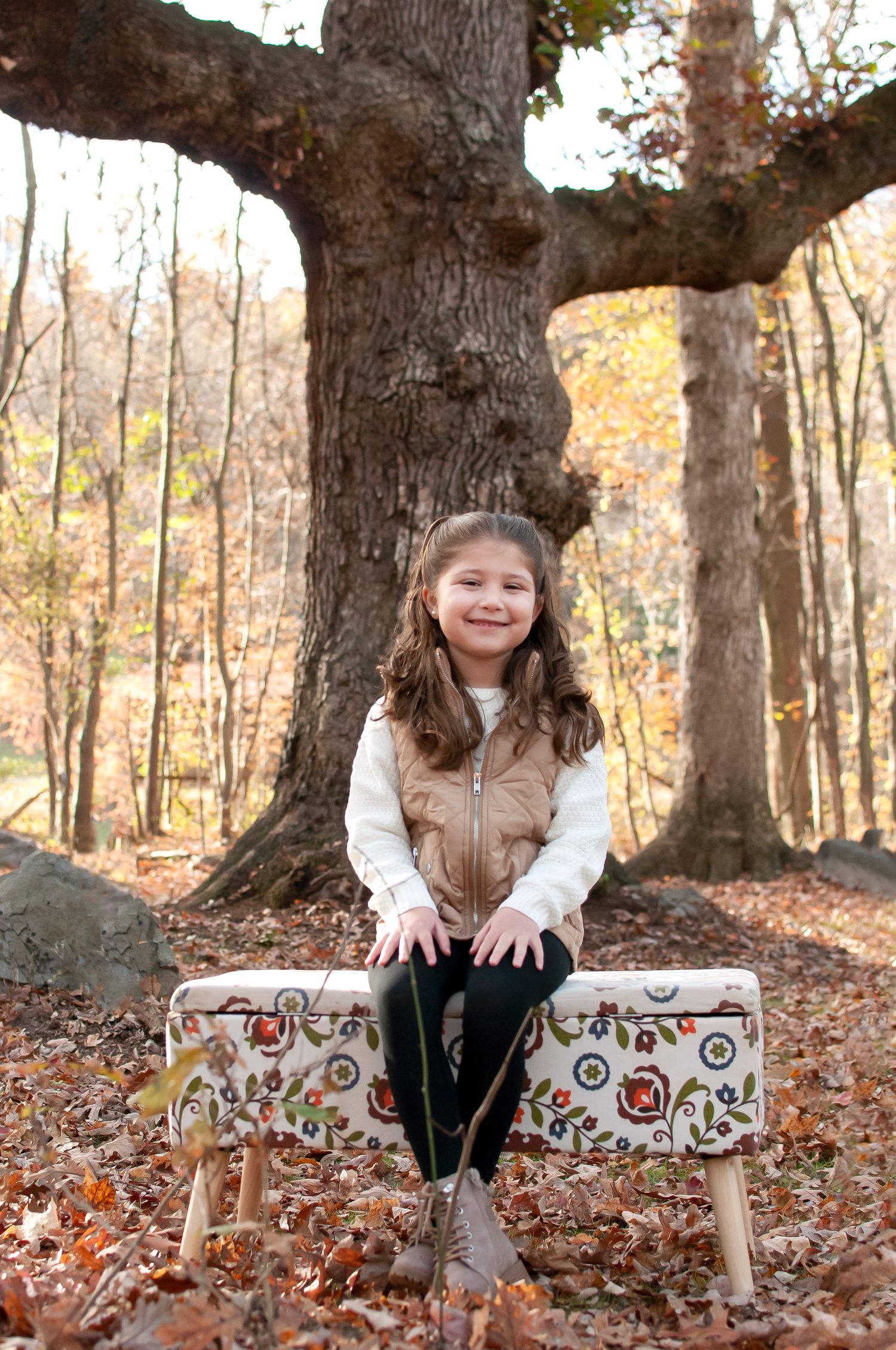 Little girl sitting on a bench in Short Hill Springs