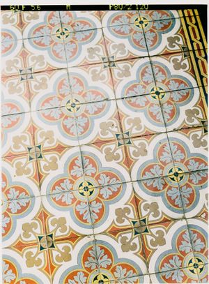 Ornate vintage floor tiles with repeating floral and geometric patterns in pastel blue, pink and beige.