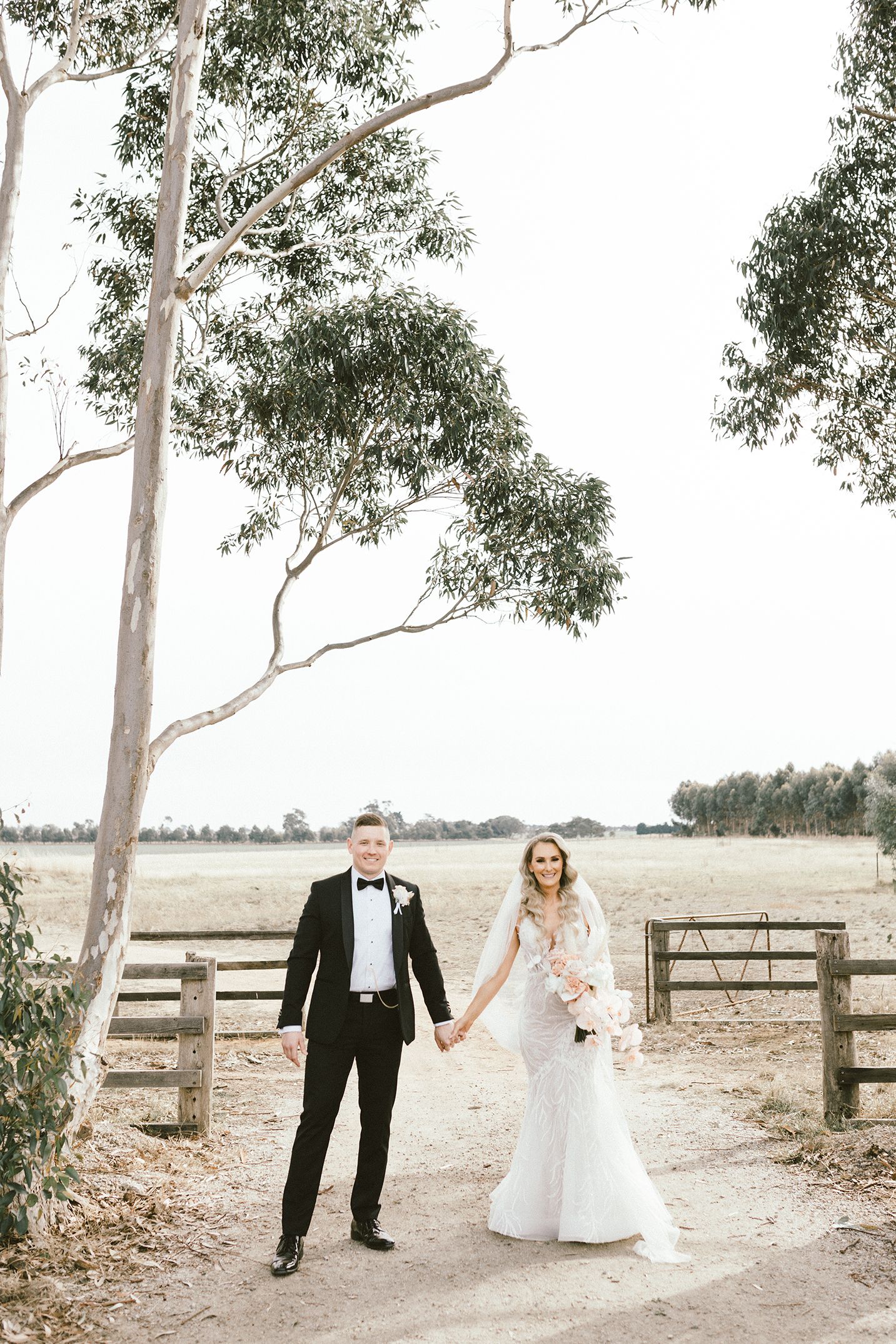 Romantic wedding portraits captured in an Australian countryside setting with eucalyptus trees.
