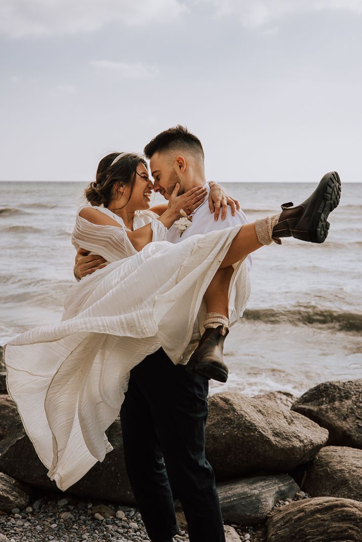 Elopement at Toronto beachfront, photo shoot , bride and groom playful