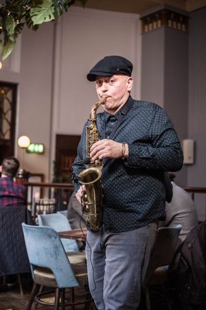 Man playing the saxophone at a PR event at the Lost and Found in Birmingham