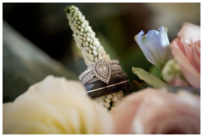 Close-up detail shots of wedding rings and delicate floral arrangements.