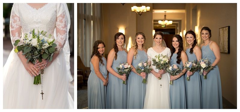 Wedding party members in blue and white attire with floral bouquets.