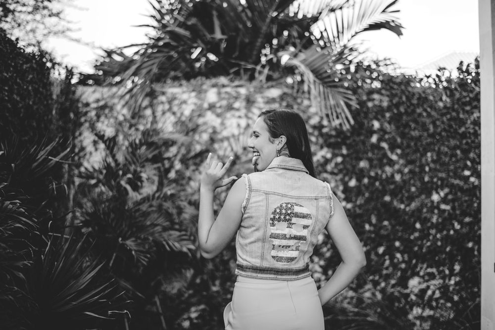 girl showing off her jacket. quinceañera photo session. XV photographer