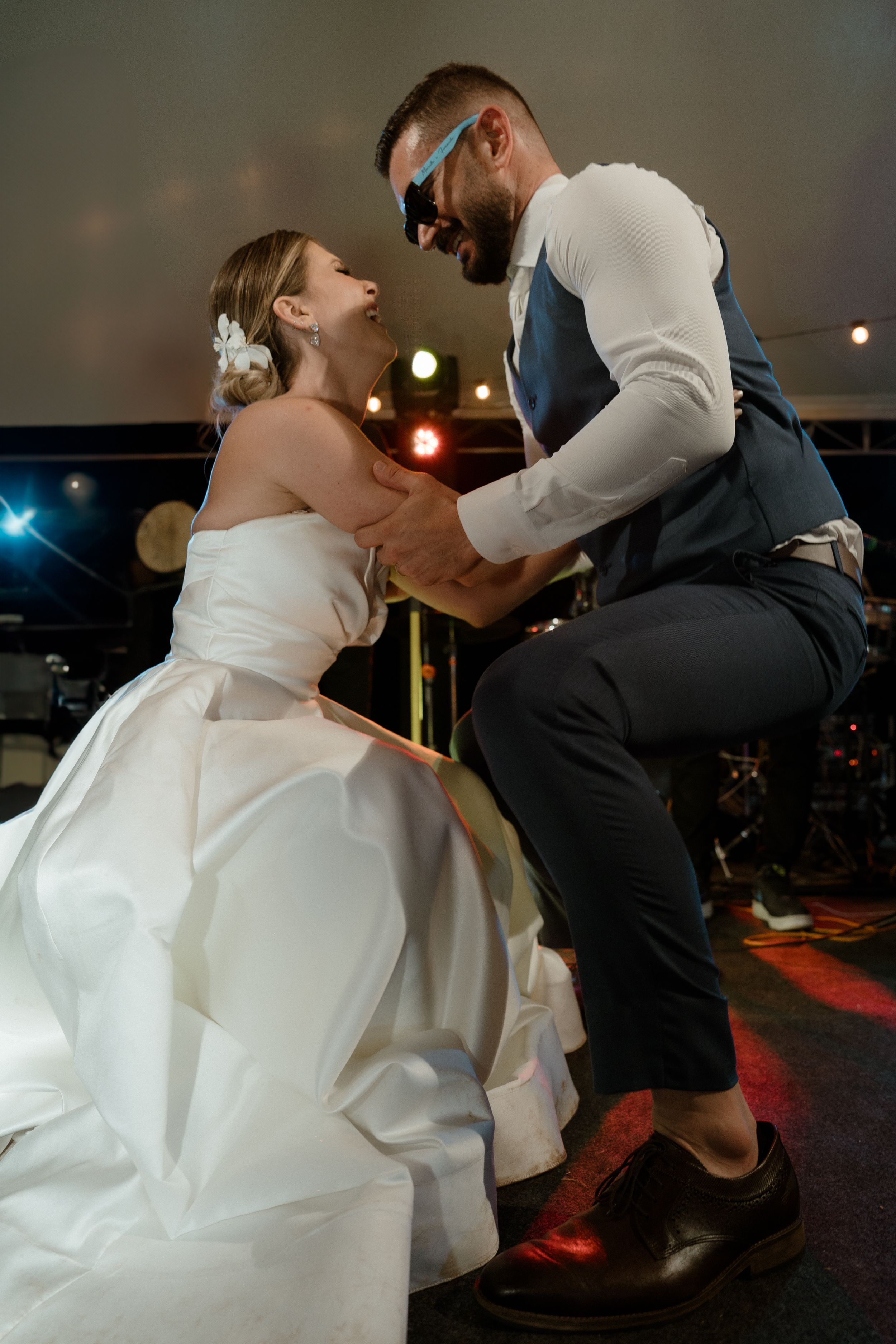 Couple sharing an intimate dance moment at their wedding reception.