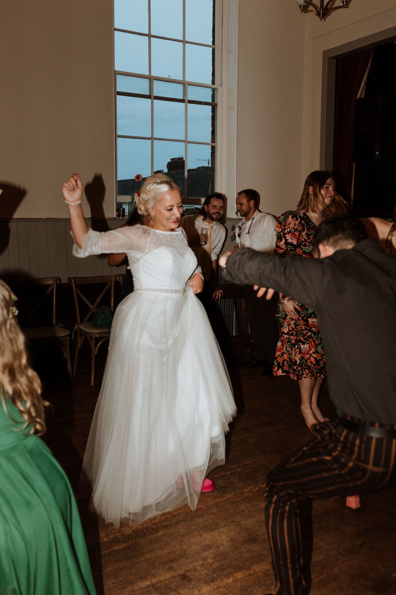 Bride throwing shapes on the dance floor