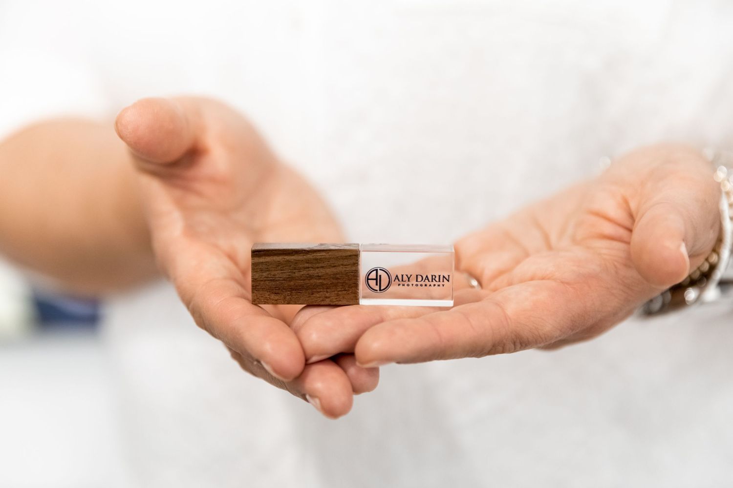 Digital senior photography products, Aly Darin Photography USB in hands