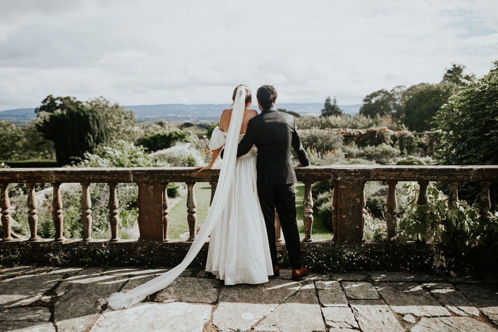 Hestercombe House & Gardens Bride and groom looking at the garden