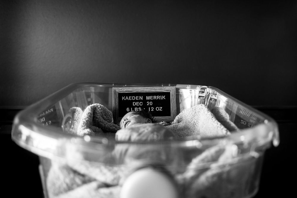 Close-up black and white image of a glass container with medical text visible.