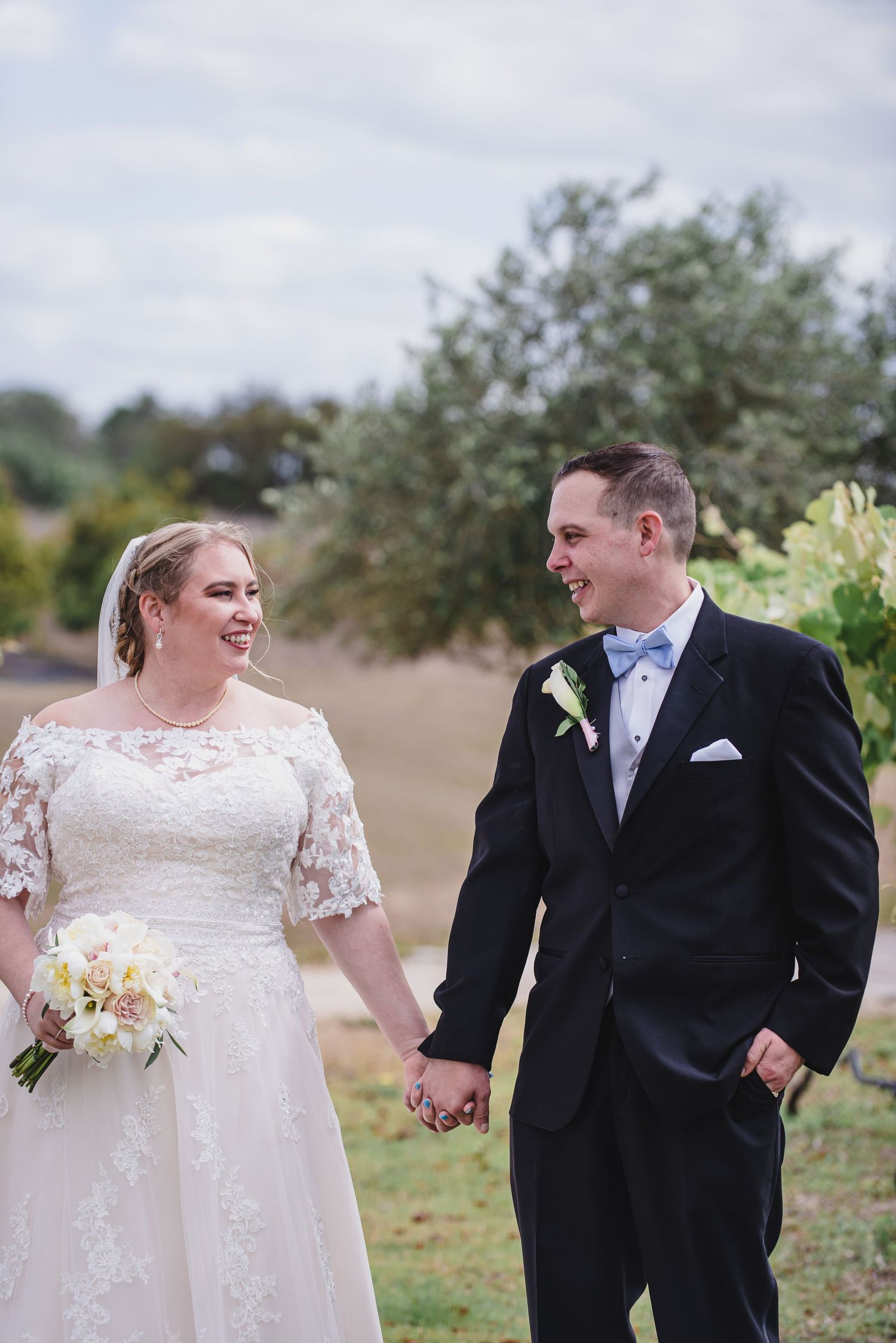 Bride and Groom hold hands in Central Florida.